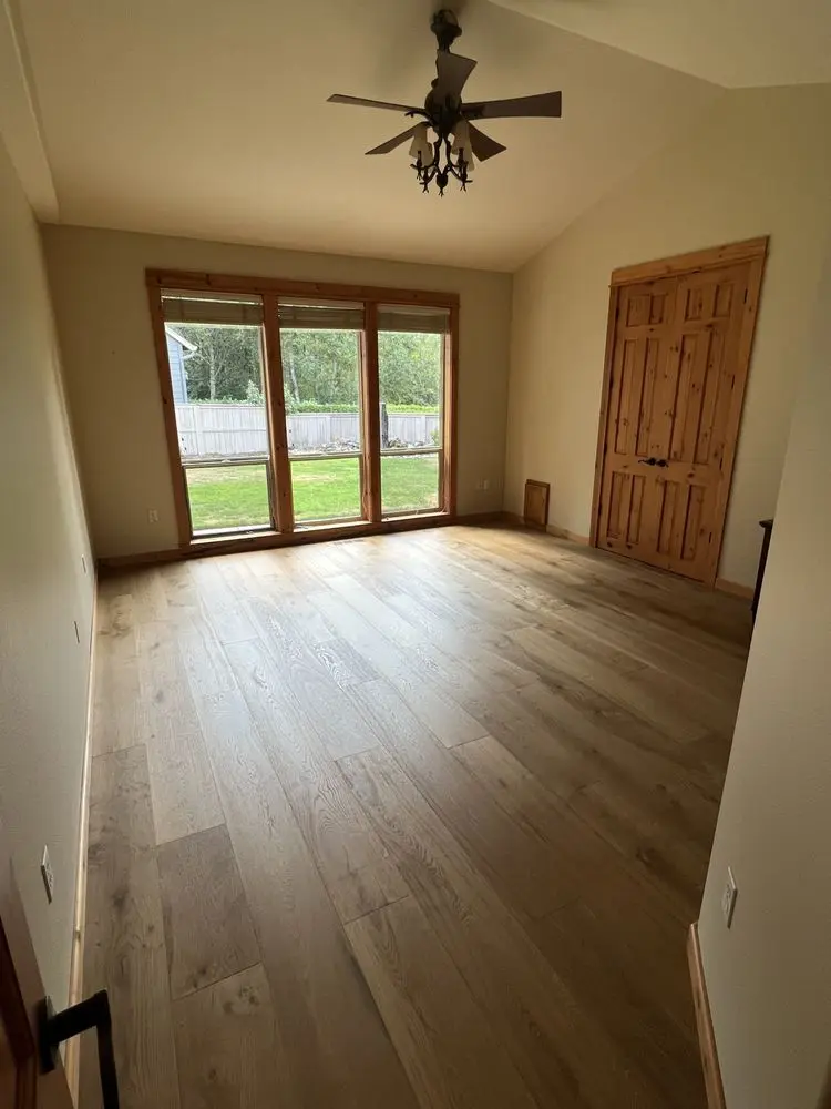 Hardwood bedroom floor by FED Builder